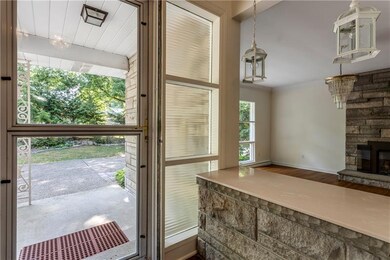 Front entry with slate tile that looks into the di