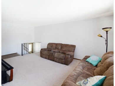 Upper level living room looking from the dining ro