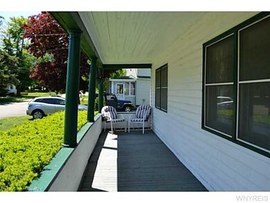 Exterior Front Wrap around porch parallel to the s