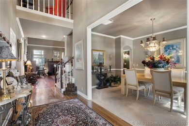 Two-story foyer open to flanked by living and dini