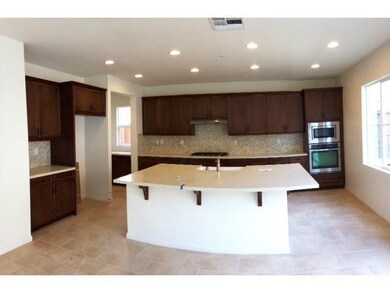 Energy star kitchen w stainless, rich cabinetry, spacious island w beautiful tile flooring