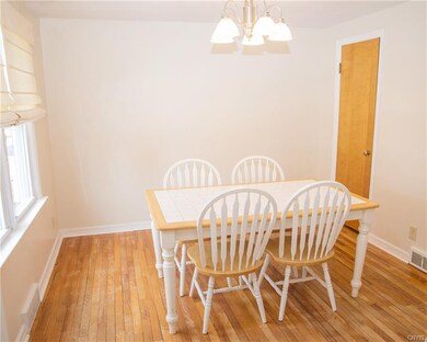 Sunny formal dining room, adjacent to the kitchen.
