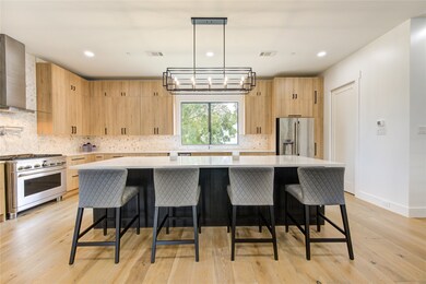 This oversized island is the focal point in this c