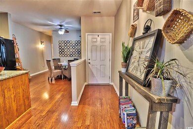 The foyer greets you with beautiful wood floors an