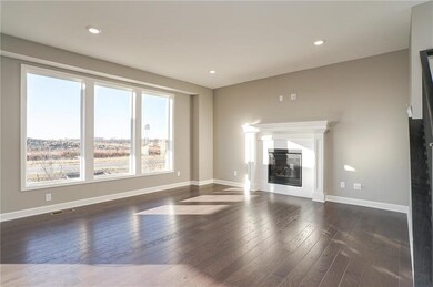 Great room has large picture windows to let in lot