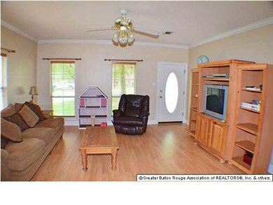Wood floors in the family room and windows to allo
