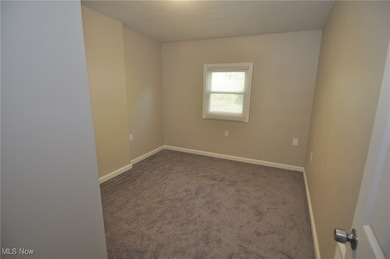 Bedroom #3 with new carpet, mini blind and wall heater