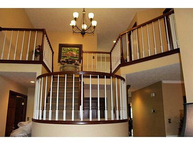 Entry/Foyer. Grand 2 story curved stairwell with c