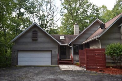 Two car garage with outside shower on the right in
