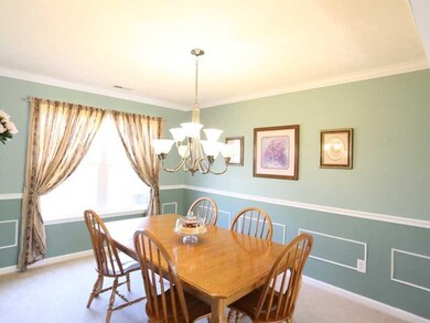 Dining Room. Enjoy family get togethers or holiday dining experiences in the spacious formal dining room. Crown molding, chair rail and wainscoting are featured.