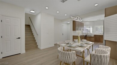 Dining space featuring light wood-style flooring, recessed lighting, and stairs