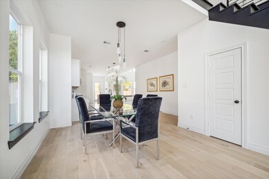 This is a bright, modern dining area with large wi