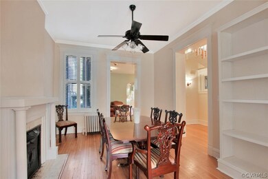Second parlor. Hardwood floors, crown moulding, fireplace.