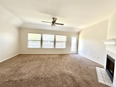 Unfurnished living room featuring a ceiling fan, 