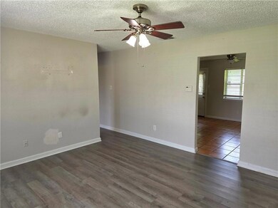 The living room features a large picture window for wonderful natural light all day.