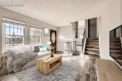 Virtually  staged Living room with a textured ceil
