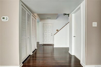 The foyer welcomes you!  The bamboo flooring adds 