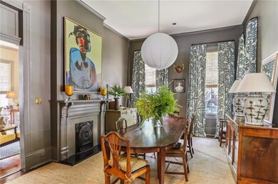 Formal dining room adjacent to a bar area that's i