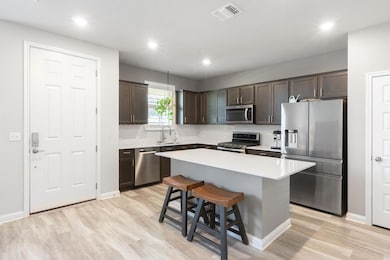 Kitchen featuring appliances with stainless steel