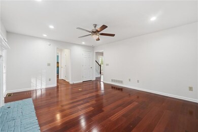 Unfurnished living room with recessed lighting, dark wood-style flooring, and ceiling fan