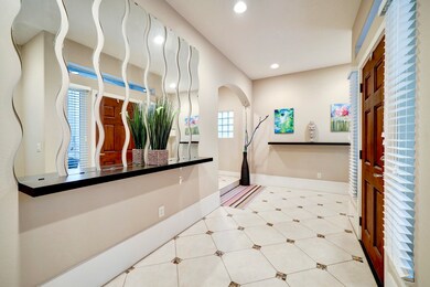 Spacious walls for artwork in the entry foyer.