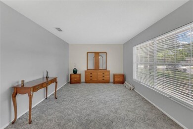 To the right of the entrance of the home is a bonus room, or flex-space.