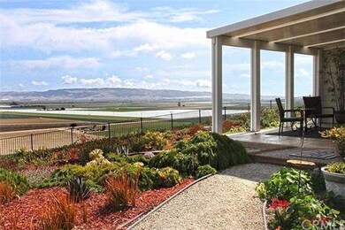 Enclosed patio with large picture windows.