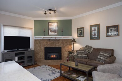 Living room with a west facing window behind the T