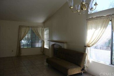 Combined living/dining room, tile floor, vaulted c