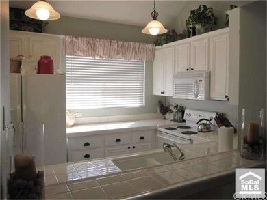 Light & bright kitchen opens to living & dining.