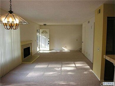 View of dining and living rooms from another persp