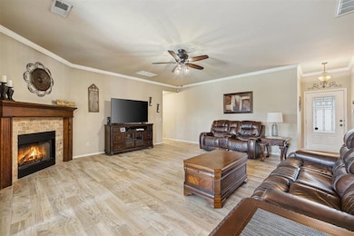 Living area with wood finished floors, visible ven