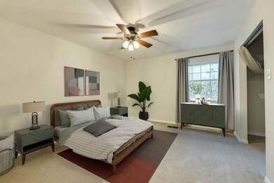 Bedroom featuring baseboards, a ceiling fan, and 