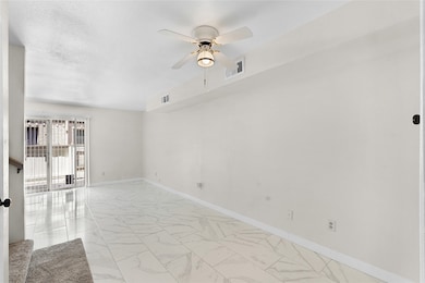 BEAUTIFUL LIVING ROOM THAT LEADS TO A WALK OUT PAT