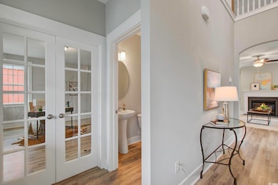 Hall with baseboards, french doors, wood finished 