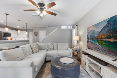 The cozy family room boasts neutral paint and lami
