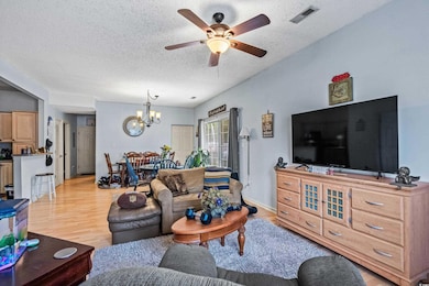 Living room featuring a textured ceiling, ceiling 