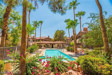 Community pool featuring a patio