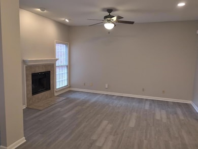 Unfurnished living room featuring dark wood finis
