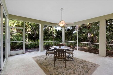 Oversized lanai surrounded by lush tropical landscaping