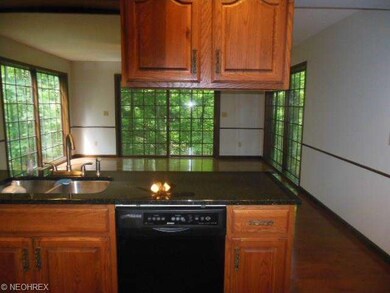 Looking from kitchen to morning rm with window wal