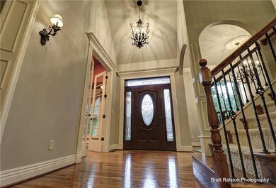 Door to front yard, office on left, dining on right