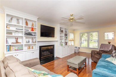 Spacious Living Room with built in shelves and gas