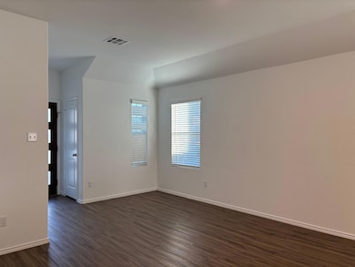 Unfurnished room with dark wood finished floors a