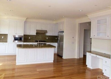 Kitchen area with built in desk off family room ar