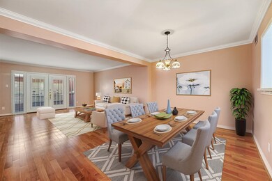Virtually staged dining area and living room. View