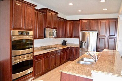 Kitchen features double ovens and a new LG refrige
