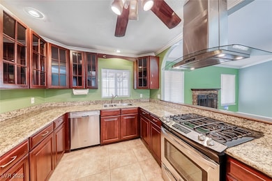 Kitchen with stainless steel appliances, a sink, i