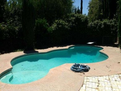 Private tree-lined pool area