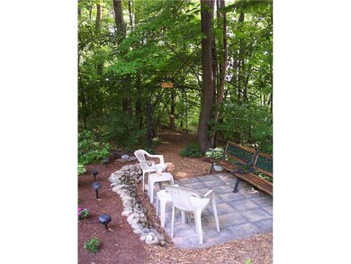 Yard/Garden. Patio area nestled by the woodline.
